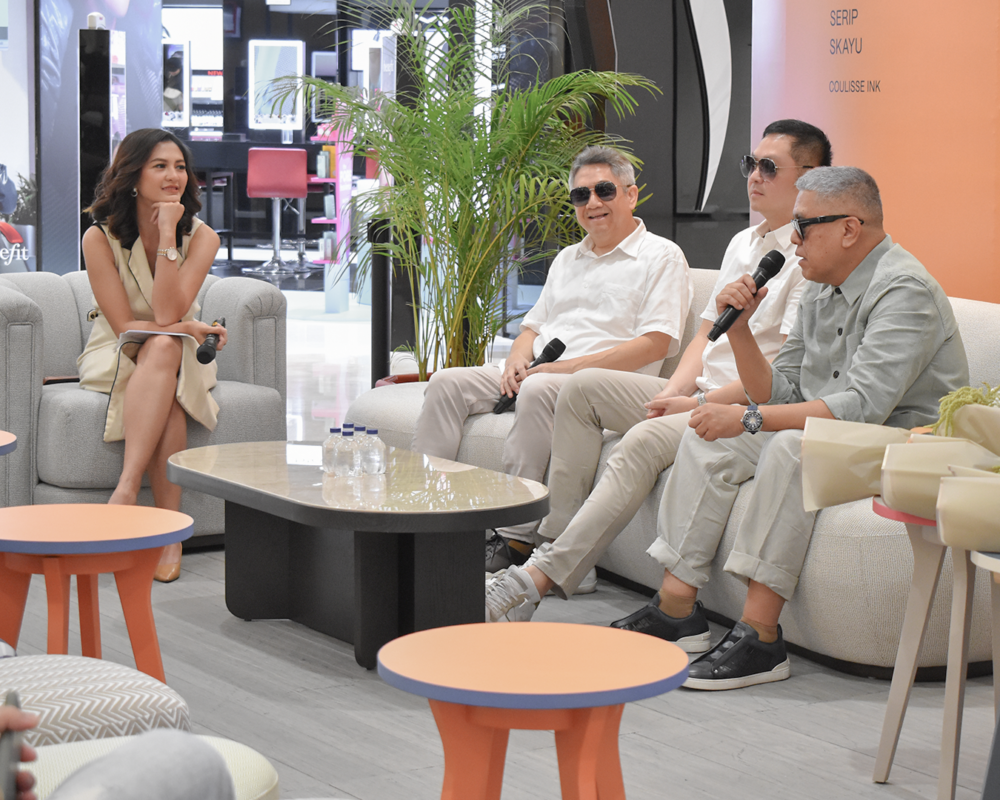 A panel discussion at The Colours of Indonesia 2024, featuring speakers seated on Modulo Living furniture with a modern and comfortable setup.